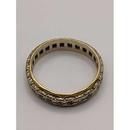 178 - A yellow and white metal gold ring stamped 18ct set with white sapphires A/F, total weight 4.6g
Loca... 