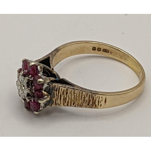 189 - A 9ct gold daisy style ring set with a diamond and pink rubies, total weight 3.7g
Location:RING