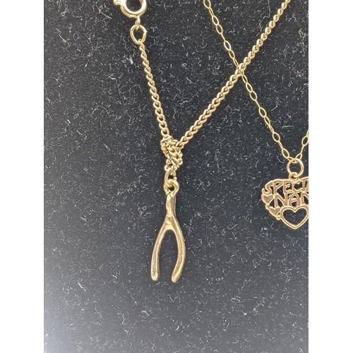 21 - Two yellow metal pendants, a 9ct gold necklace, along with a 14ct gold necklace, total weight 2.5g, ... 