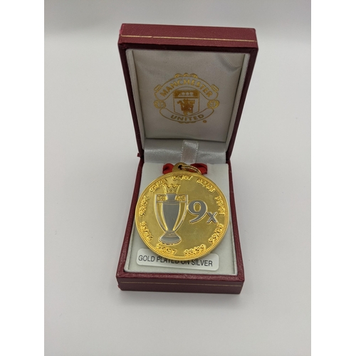 27 - A boxed Barclays Premiership Champions Manchester united medal gold plated on silver, total weight 3... 