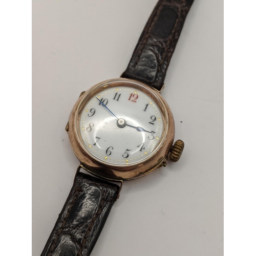 362 - An early 20th Century 9ct gold cased ladies wrist watch on a leather strap. CAB2