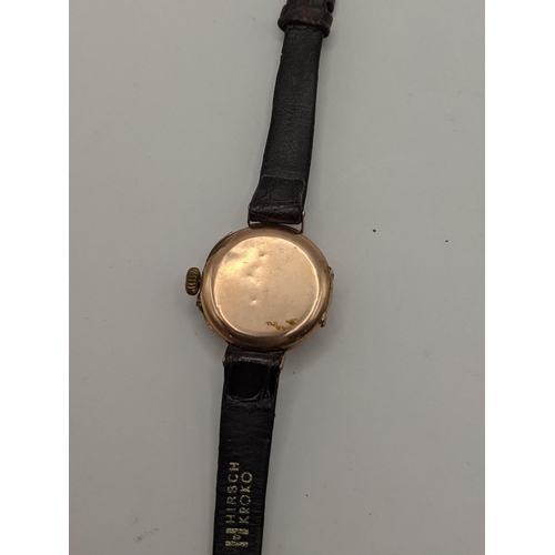 362 - An early 20th Century 9ct gold cased ladies wrist watch on a leather strap. CAB2