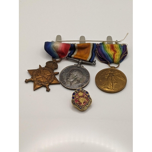 46 - Militaria comprising a regimental horse whip, a set of three WWI medals 37182 DVR J F Webster RA and... 