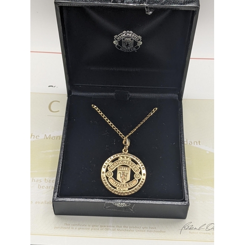 5 - A boxed 9ct gold Manchester United Centenary pendant, on a 9ct gold necklace, total weight 5.1g, wit... 