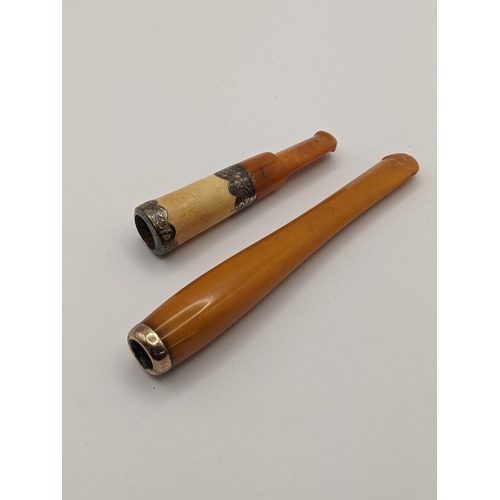 51 - A silver banded cigar holder having an amber mouthpiece, together with an amber cigarette holder Loc... 