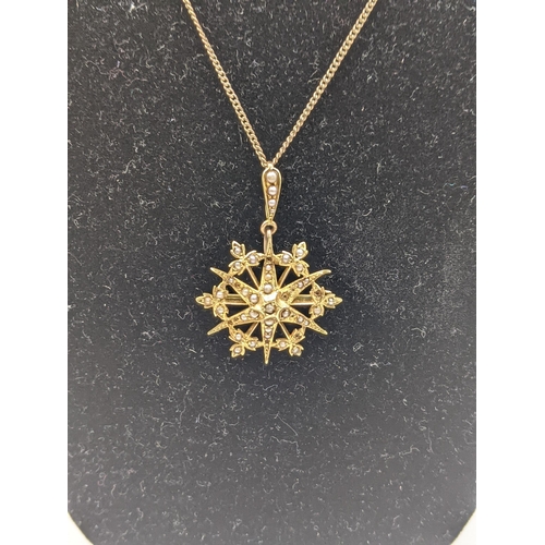 59 - A Victorian 15ct gold star pendant set with seed pearls 4.1g A/F Location:CAB3