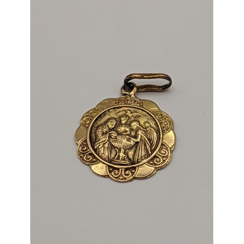 7 - A yellow metal religious pendant, 1.5g, together with a sterling silver Niello ring having detail of... 