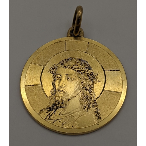 8 - A 18ct gold pendant with engraved detail of Jesus Christ, total weight 6.4g
Location:CAB3