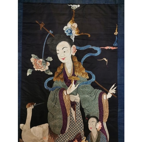 93 - A large Chinese Qing dynasty embroidered silk panel depicting the Queen Mother of the West, with an ... 