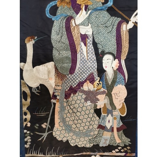 93 - A large Chinese Qing dynasty embroidered silk panel depicting the Queen Mother of the West, with an ... 