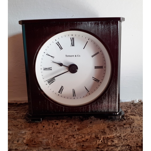 234 - Tiffany & Co-A small pewter coloured bedside clock with PGA European Tour inscription 'East Sussex N... 