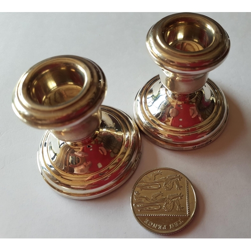 238 - Asprey-A pair of dwarf silver candlesticks in branded box. Location:TABLE2