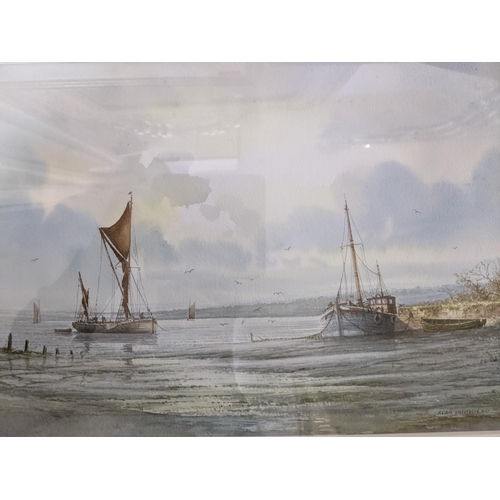 148 - Alan Whitehead - a group of three framed and glazed coastal watercolours depicting fishing craft moo... 