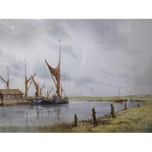 148 - Alan Whitehead - a group of three framed and glazed coastal watercolours depicting fishing craft moo... 