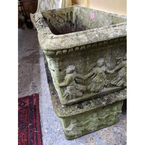 157 - A pair of weathered cast stone garden plant troughs with moulded ornament Location:G