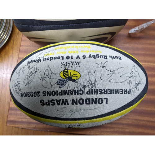 160 - A 2003/04 Wasps rugby ball signed by members and a match played rugby ball Location:G