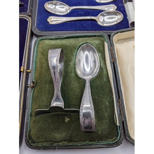 247 - A silver cased christening set 50g, together with a cased set of six silver teaspoons, and sugar ton... 