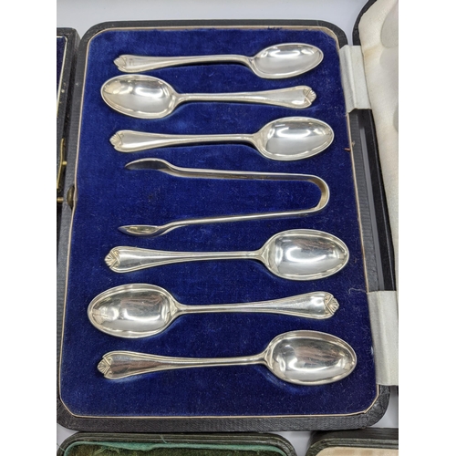 247 - A silver cased christening set 50g, together with a cased set of six silver teaspoons, and sugar ton... 