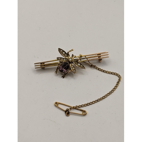 274 - A 9ct gold bar brooch in the form of a bug set with a purple amethyst and seed pearl, total weight 3... 