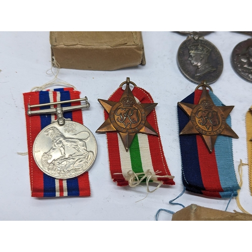 351 - A group of WWII medals to include 1939-1945 British War medals, the Defence Medal, Campaign stars to... 