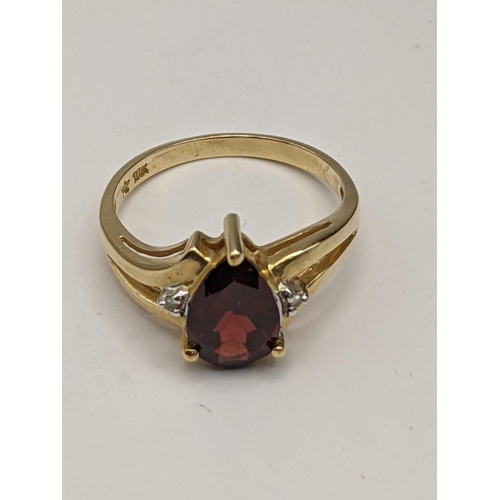 213 - A 10ct garnet ring, total weight 2.6g
Location:RING