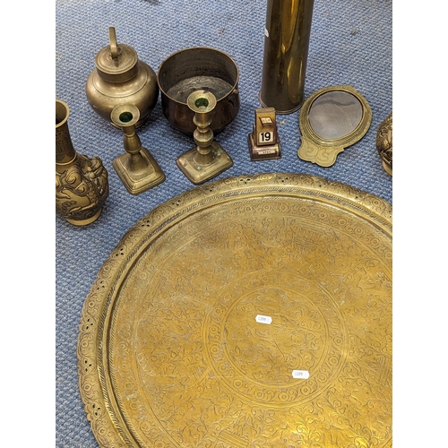 186 - Brassware to include an Indian tray, a pair of Oriental vases, candlesticks, a mirror and other item... 