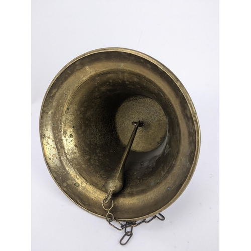 174 - A brass ships style bell with a bracket and flower head ornament
Location:LWB