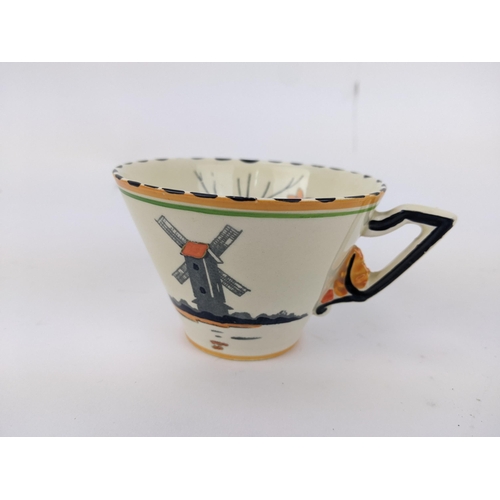73 - A Zenith Art Deco china tea set decorated with a windmill by a lake and tree comprising six cups, si... 