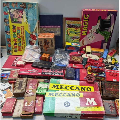 13 - A mixed lot of toys and games to include boxed Meccano, Chad Valley Give A Show Projector, boxed car... 