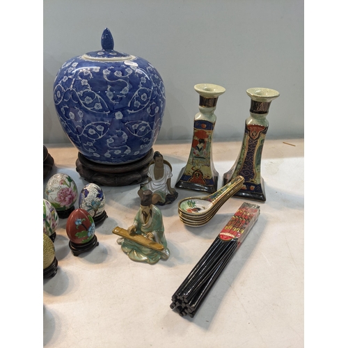 149 - Oriental items to include a Chinese blue and white ginger jar on a base, Satsuma candle sticks, a co... 