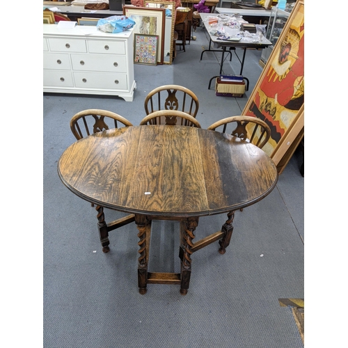 152 - A set of four Ercol Windsor Chairs and a 1930s oak gale leg, barley twist table. 6 boxes of ceramics... 