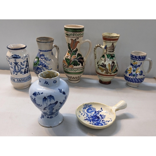 19 - A selection of earthenware ceramics to include a 18th century Dutch delft vase, Romanian jugs and ot... 