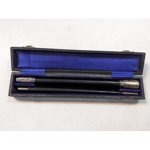 23 - A late 19th/early 20th century silver and ebony conductors baton in a fitted case
Location:A4B