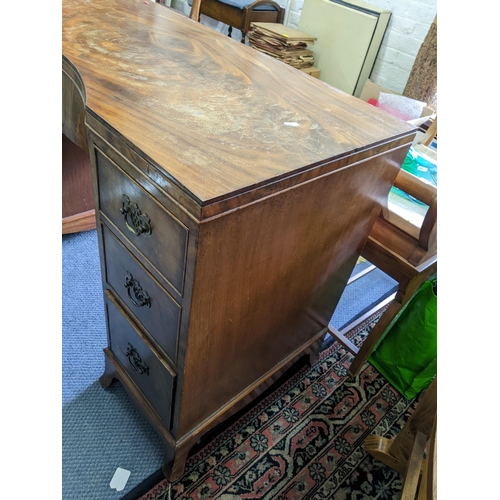 282 - A mid 20th century walnut desk having a central bow drawer flanked by six drawers 74cm h x 108 cm w
... 