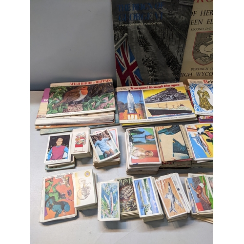 30 - A mixed lot to include cigarette cards loose and in albums, souvenir coronation programme, Anglo con... 