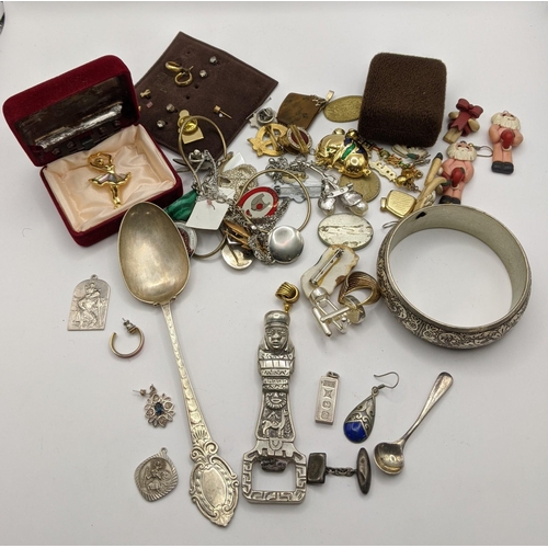 31 - Mixed silver and white metal to include a silver tea spoon, a bottle opener stamped 925 and others 1... 