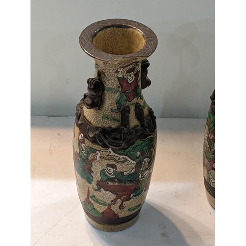 47 - A pair of early 20th century Chinese crackle glazed vases decorated with warriors 
Location: 1.1