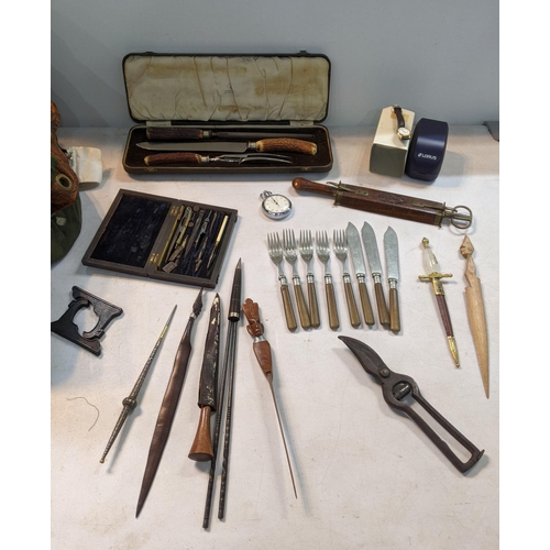 52 - A mixed lot to include a Lorus watch, carving set in a case, vintage rulers, a Smiths stopwatch
Loca... 