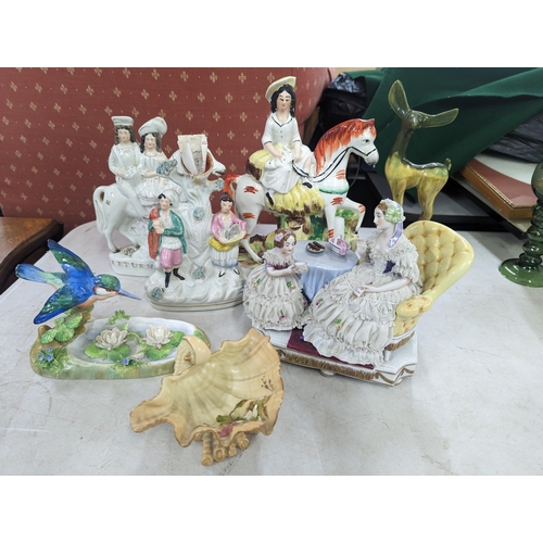 55 - A group of early 20th century and later ceramic figures A/F to include Staffordshire, a figure group... 