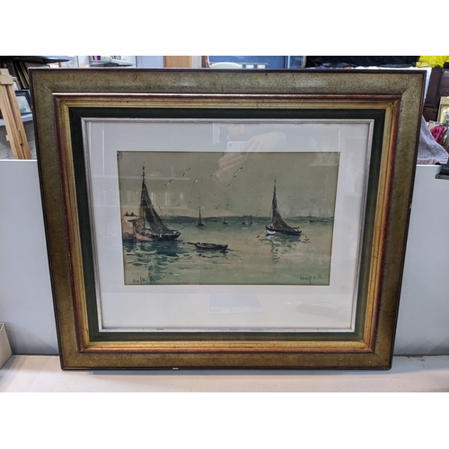 63 - A French framed and glazed watercolour depicting  moored fishing boats, signed indistinctly to the l... 