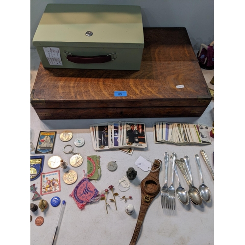 65 - A mixed lot to include silver plate, a Wedgewood biscuit barrel, nurses watch, cigarette and cards
L... 
