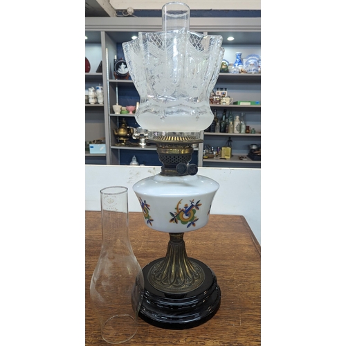401 - A vintage brass oil lamp having floral decorated glass shade and decorated glass rostrum Location:SR