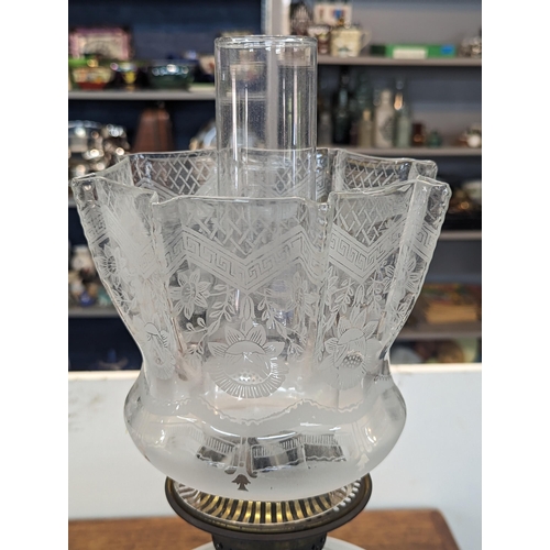 401 - A vintage brass oil lamp having floral decorated glass shade and decorated glass rostrum Location:SR