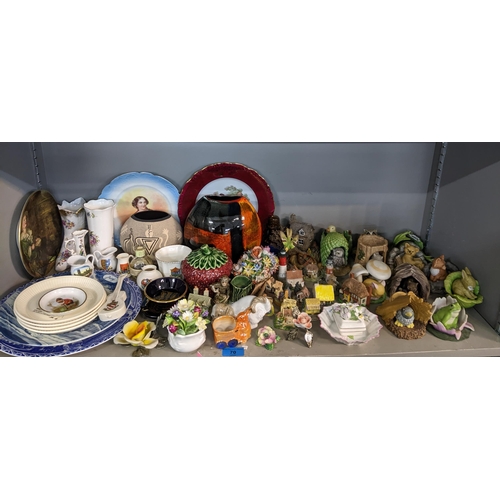 70 - A mixed lot of ceramics to include a Poole pottery purse shaped vase, Royal Worcester bronze and por... 