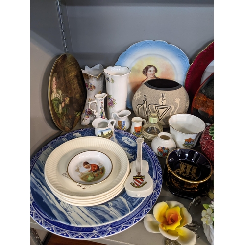 70 - A mixed lot of ceramics to include a Poole pottery purse shaped vase, Royal Worcester bronze and por... 