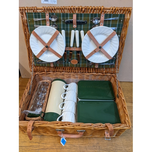 72 - A W A Goold wicker picnic hamper, fitted interior with cutlery, Thermos flask and other accessories ... 