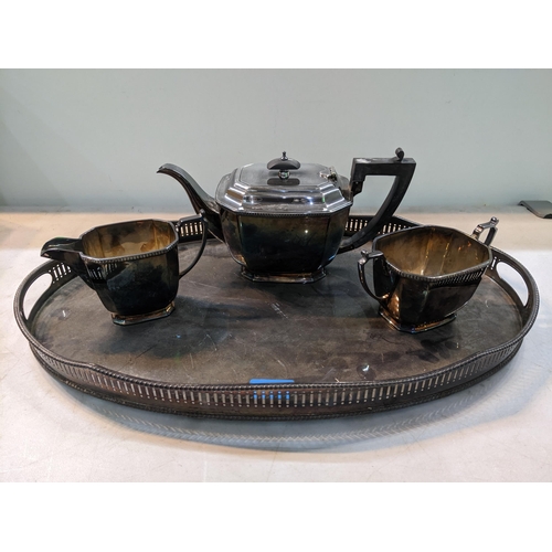 82 - A Mappin & Webb silver plated three piece tea set on a Mappin & Webb oval silver plated gallery tray... 