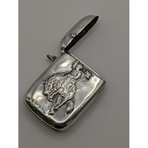 38 - A sterling silver vesta case with embossed detail of a man riding a horse, total weight 42g, Locatio... 