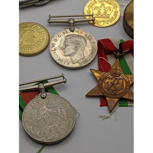 49 - A mixed lot to include a 1937 hobo nickel, together with a WWII medals, silver plated cigarette case... 