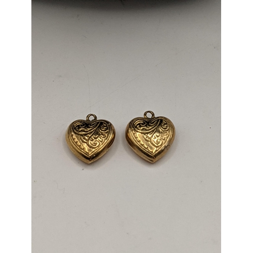 62 - A 9ct gold pendant set with a pearl, a necklace and two 9ct gold heart pendants, 2.4g
Location:CAB3